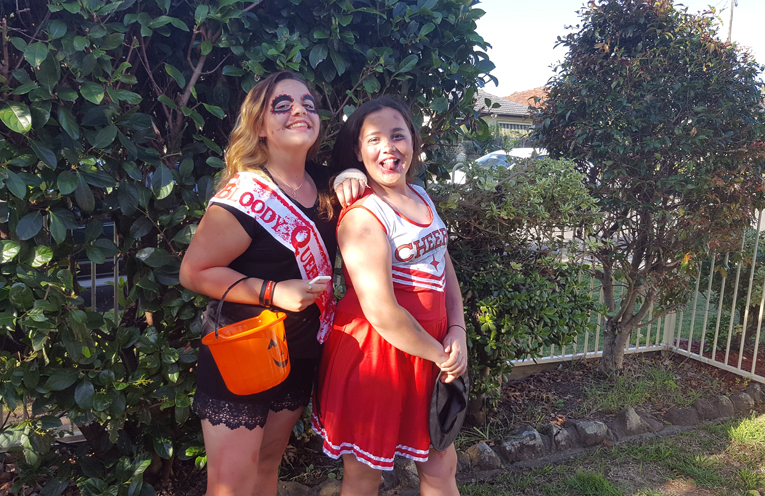 Two school friends having a blast on Halloween.