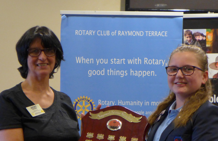 Rotary Club President Jacky Gendre presenting the Shield to Tahlia Jarvie from Seaham Public School. 
