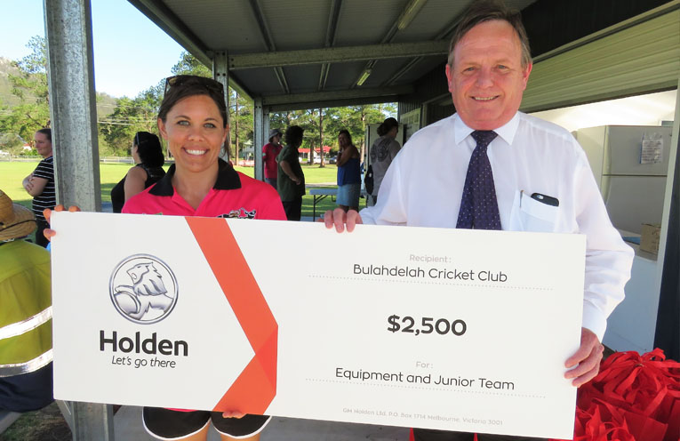 Junior cricket team manager Erin Matheson with Newcastle Holden Sales Manager Alan Curtis. 