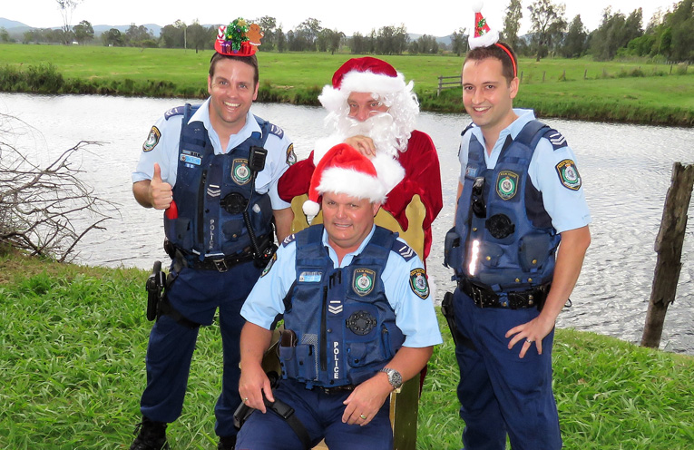 Sn Constables Ash Ray, Trevor McLeod and Dave Feeney with Santa. 
