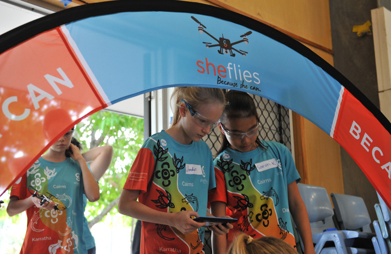 Girls get hands on experience flying drones.