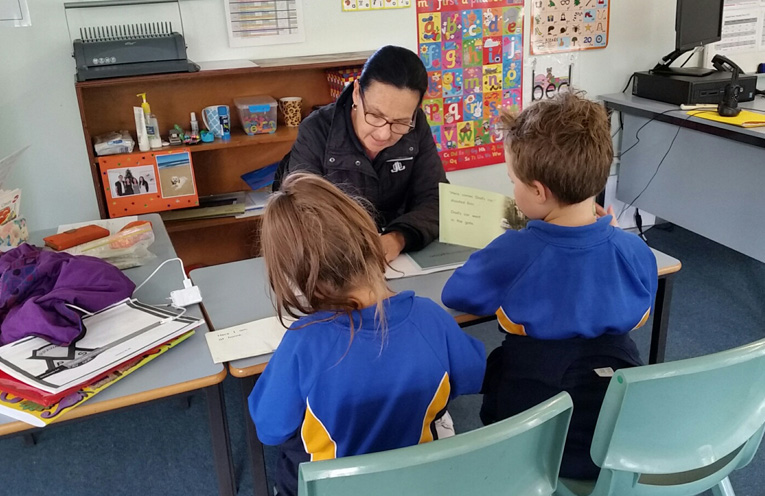 Mrs Cowan and students working together. 