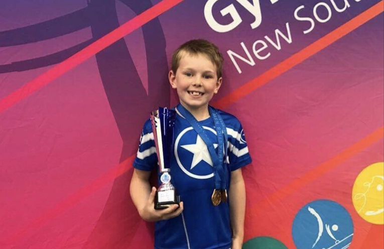 Josh showing with one of his awards.