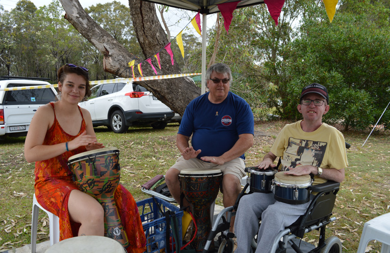 Drummer Phoebe Campbell from Pachamama Healing with Scott Diver and his carer, Michael Hill from Lifestyle Solutions.