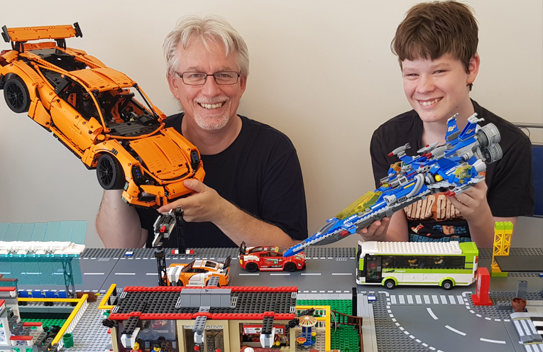 Kevin Evans and and his son Tristan Evans with some of their Lego creations.