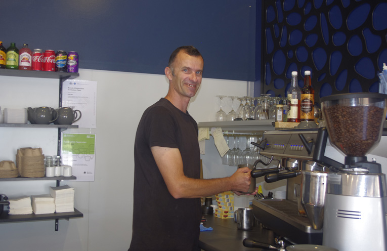 Jeremy Scheerlinck pumping out coffees at Rubi Blue Anna Bay’s first new business in the retail trading precinct in years. Photo by Marian Sampson.