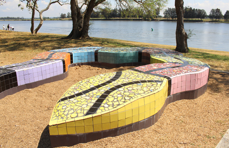 Say hello to the serpent sculpture and enjoy the nearby play equipment down on the river at Riverside Park.
