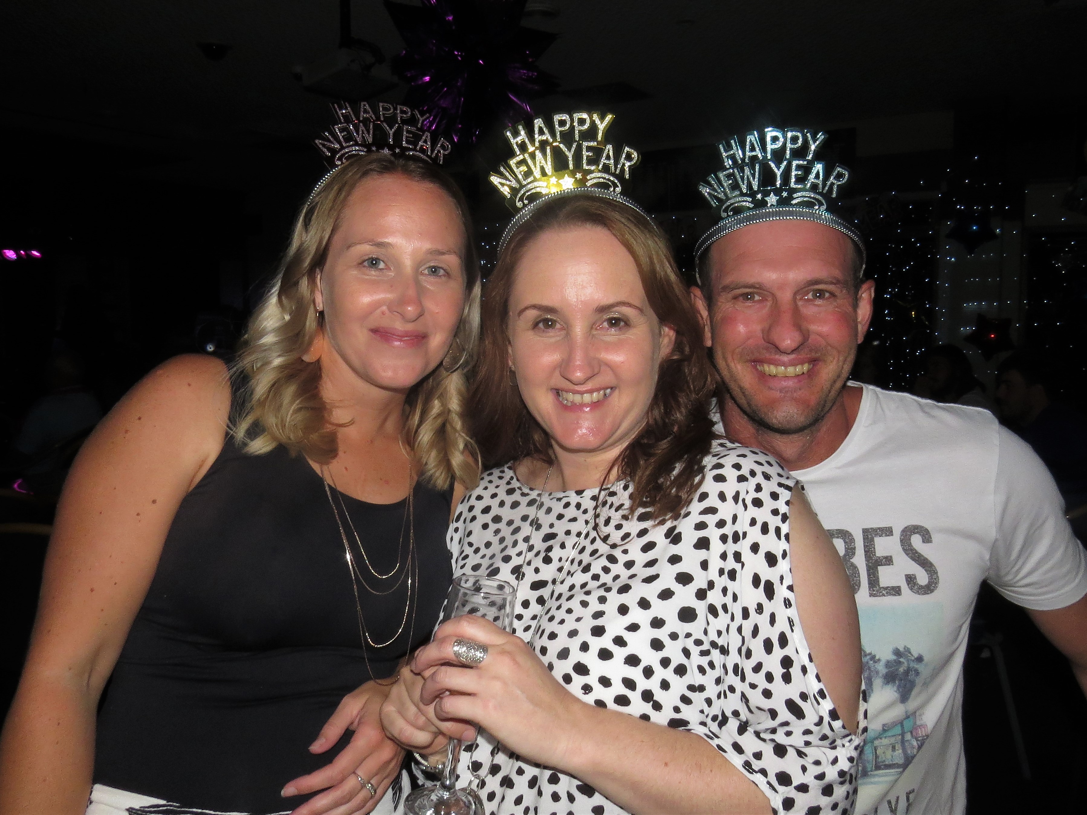 Stacey Hoare, Kirsty Harvey and Darren Carrall ring in the New Year at Bulahdelah Bowling Club.