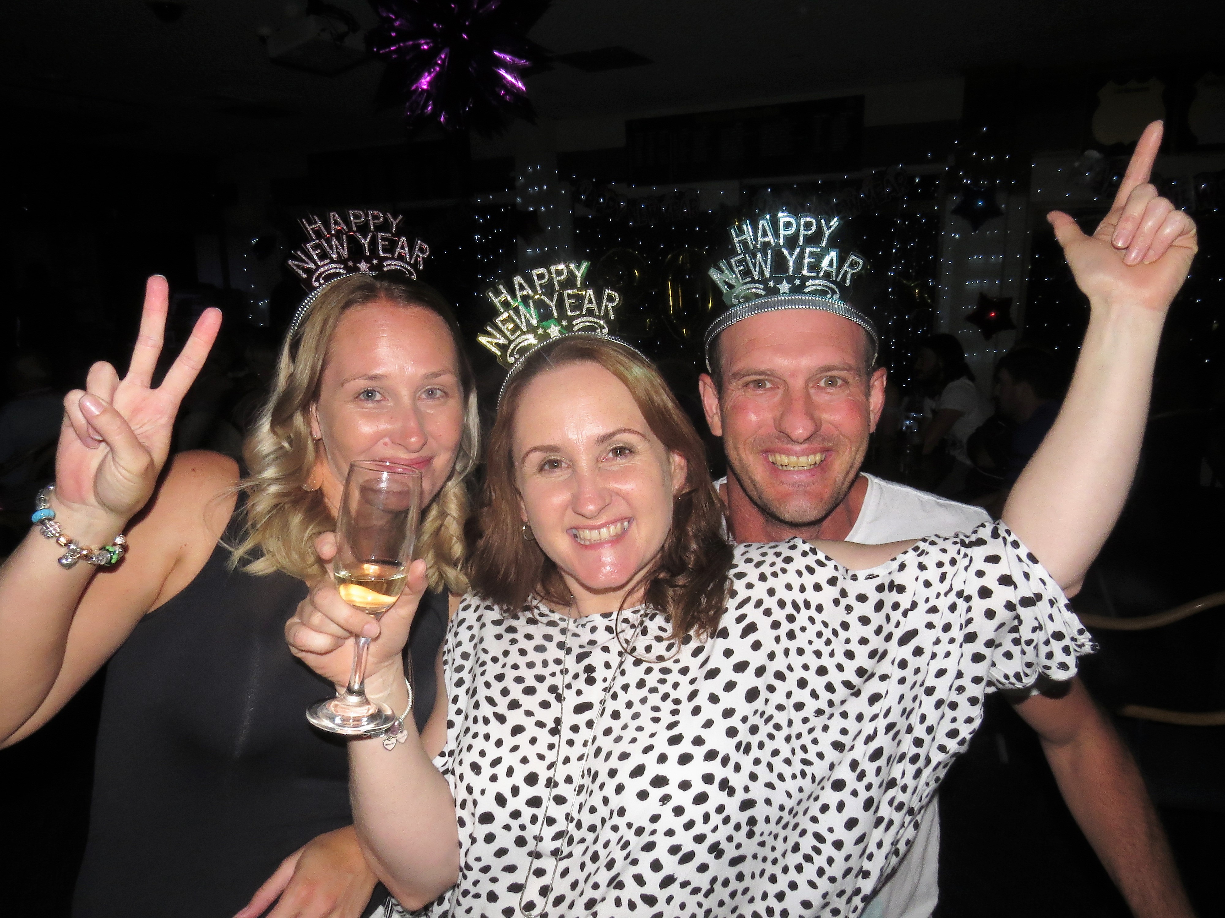 Stacey Hoare, Kirsty Harvey and Darren Carrall ring in the New Year at Bulahdelah Bowling Club.