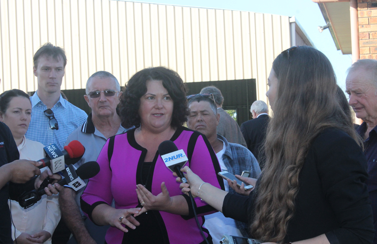 Federal Member for Paterson Meryl Swanson addressing the media with residents affected by contamination