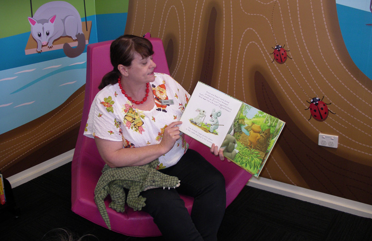 Melissa Donn reading to children.
