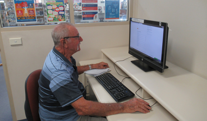 Port Stephens library customer Mr Barry Haigh using one of Tomaree Library’s free Internet computers.