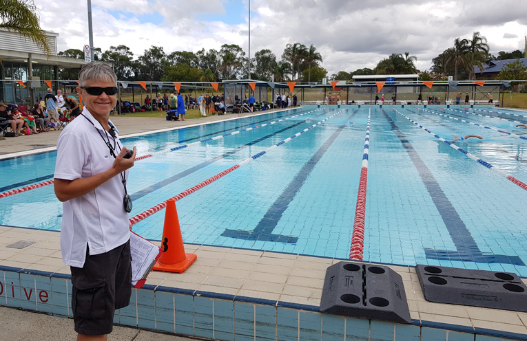 Sue Neuner, a Raymond Terrace Masters member, also a triathlete, assisting with official duties at the Carnival. 