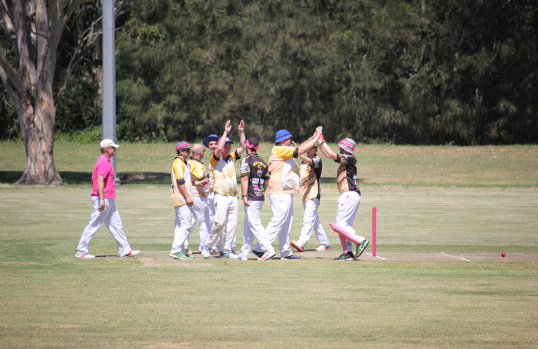 Celebrating a wicket on Pink Stumps day. Photos by Andrew McKenzie