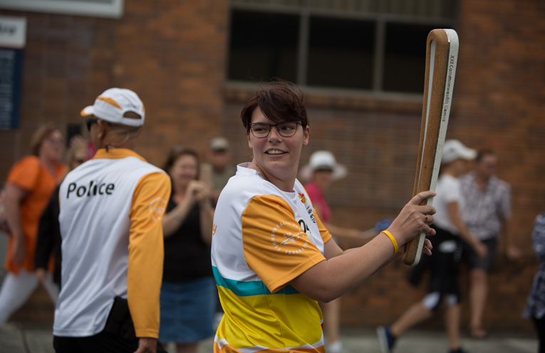 Batonbearer Jennefer Trott carries the Queen’s Baton in the relay through Forster. 