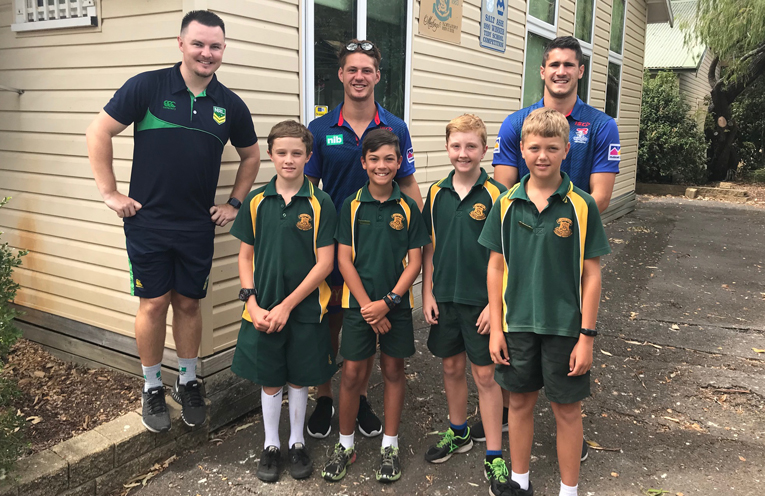 Salt Ash Public School students; William, Lucian, Riley and Patrick, with Luke from the Nrl, Kalyn Ponga and Jack Johns.