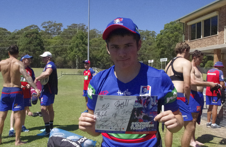 Dylan Fry with his signed Knights memorabilia. Photo by Marian Sampson.