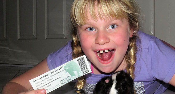 WINNER: Maggie Cunich and Oreo the Guinea Pig with her family ticket to the zoo.