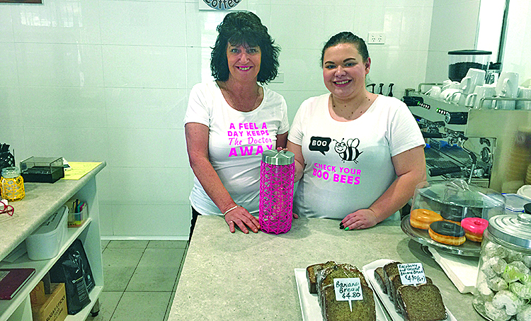1.	Owner Carol, and Barista Beth sporting their Breast Cancer Awareness shirts.