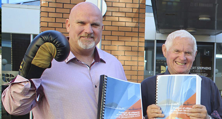 Councillor and Deputy Mayor Chris Doohan with Mayor Bruce MacKenzie holding Anti-merger petition orgainiser earlier this year. 