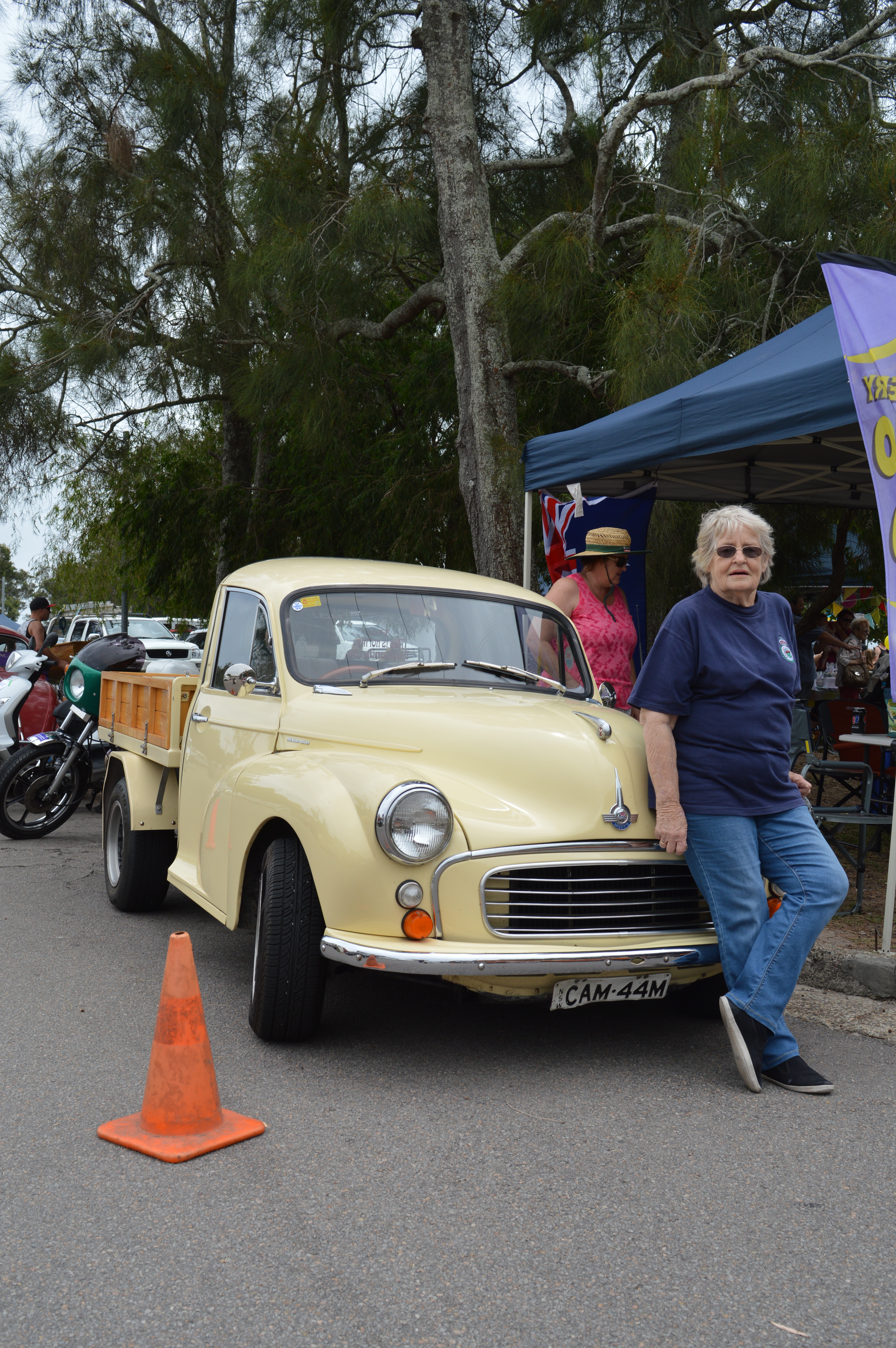 Rural Fire Service volunteer and Tilligerry Auto Club member Judy Camm with her 1958 Morris Minor 1000 Utility.