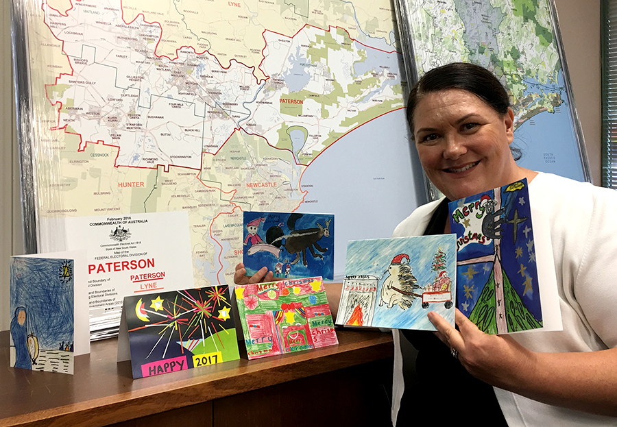 Meryl Swanson with her Christmas cards; the winner is on the right.