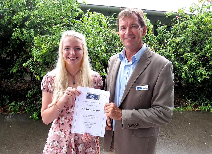 SCHOLARSHIP: Mckelty Searle accepts her award from Great Lakes Education Fund Chairperson Stephen Nicholas.