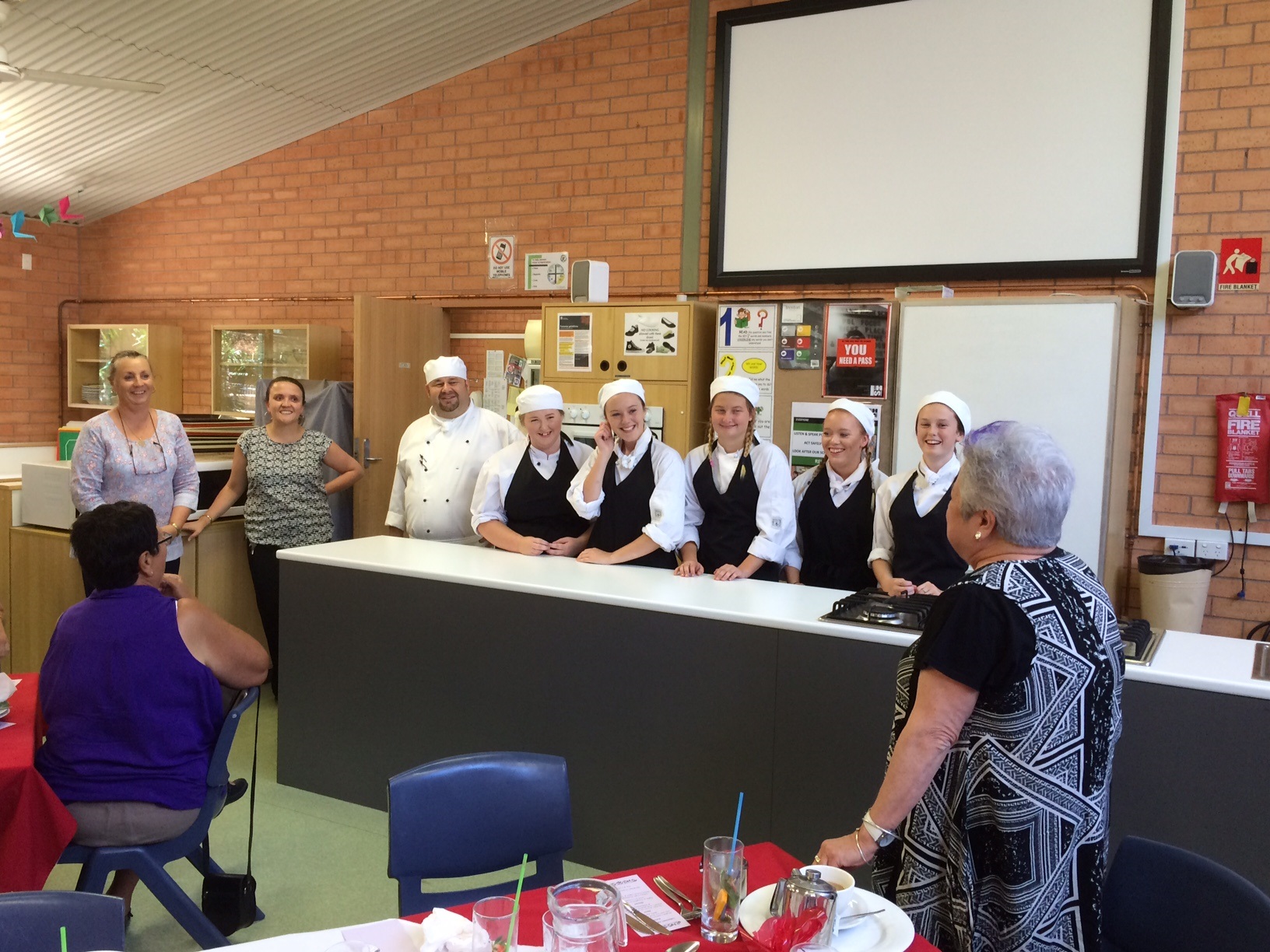 Jenny Noone (Head Teacher), Tash Alexander (Teacher) Mr Chris Enright (TAS Teacher) and student chefs, Leiteisha Rochester, Gabby Rae, Paige Focic, Emily Green and Nikita Taylor being thanked by Plan-It Youth Mentor Jan Noake