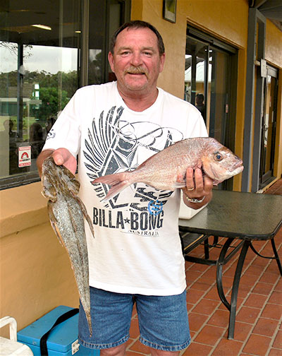 Runner-Up Paul Hunt proudly displaying part of his fishing outing catch.