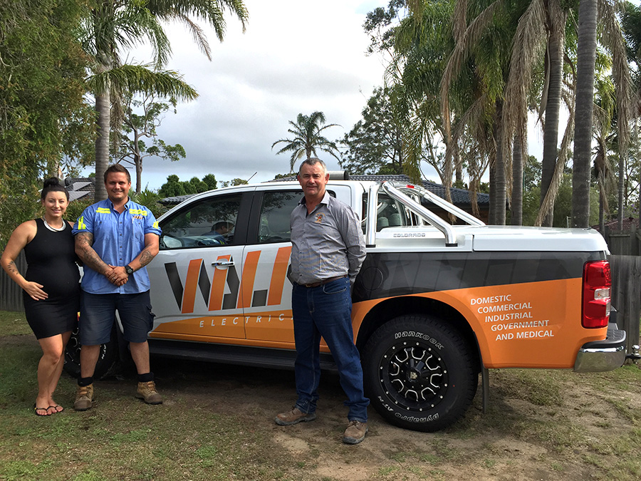 Dwayne Murphy from Medowie Marauders Rugby Union Club with the owners of Walk Electrical Daniel and Ashton Walk
