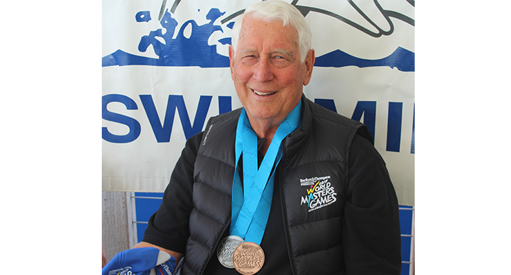 Peter Kellaway proudly displays his medals.