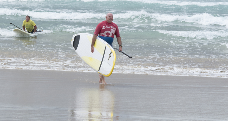 Ross Blanchard and Price Connor return from their friendly battle on the waves. Photo by Square Shoe Photography