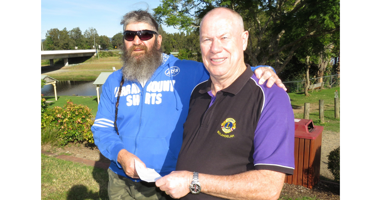 Roger Dixon accepts a donation on behalf of the Bulahdelah Activity Park Committee from Hunting Club Treasurer, Greg Russell.