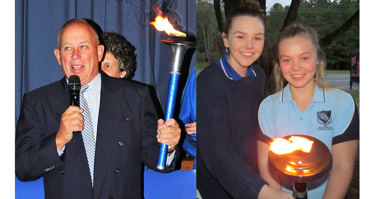 MidCoast Council Administrator John Turner accepts the peace torch on behalf of the community. Photo: Supplied 
