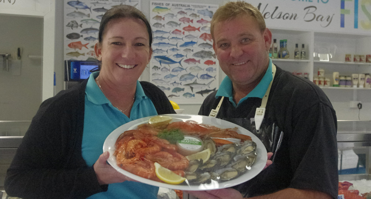 Katrina Hill and Darren Dodd showing off local produce at Nelson Bay Fish Market.