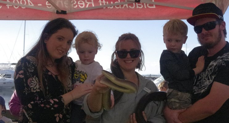Kayla Renshaw, Abbie Thomas, Xavier Thomas and Ben Thomas with Isabel Gibson and a very large snake from Blackbutt Reserve at the free reptile show at Koala Gala. 