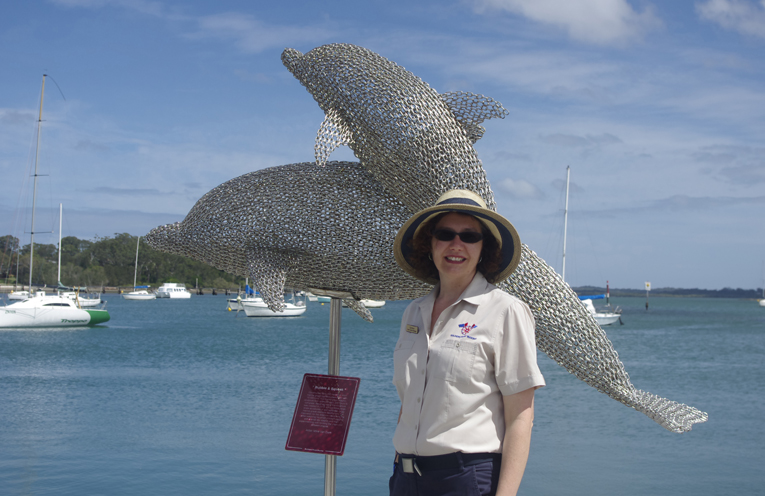 Carmen Holden of Soldiers Point Marina with the chain sculpture ‘Bubble and Squeak’. Photo by Marian Sampson