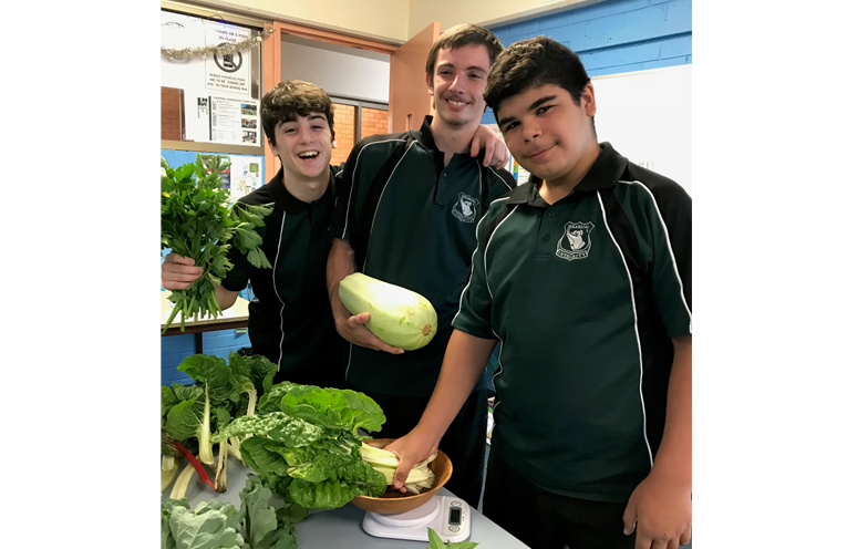 Jack Elder, Connor Turnbull and Nathaniel West-Doyle preparing the produce for sale.
